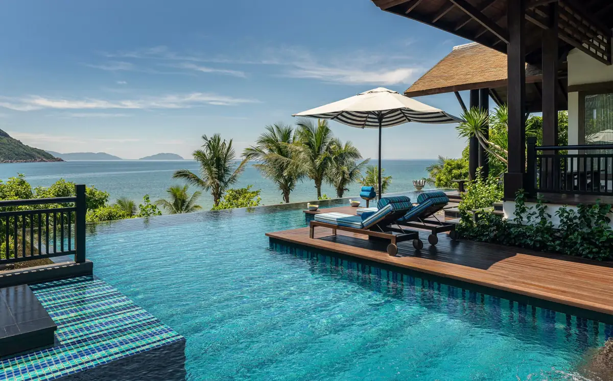A villa infinity pool and shaded terrace overlooking the East Sea at the InterContinental Da Nang, Vietnam